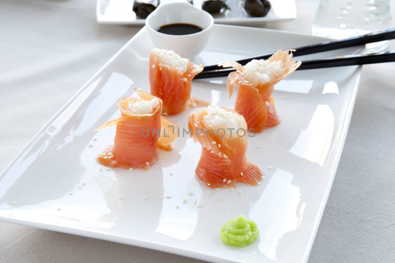 Sushi:  Fresh salmon filled with rice and sesame seeds, served with wasabi. with rice and sesame seeds, served with wasabi. with rice and sesame seeds, served with wasabi.