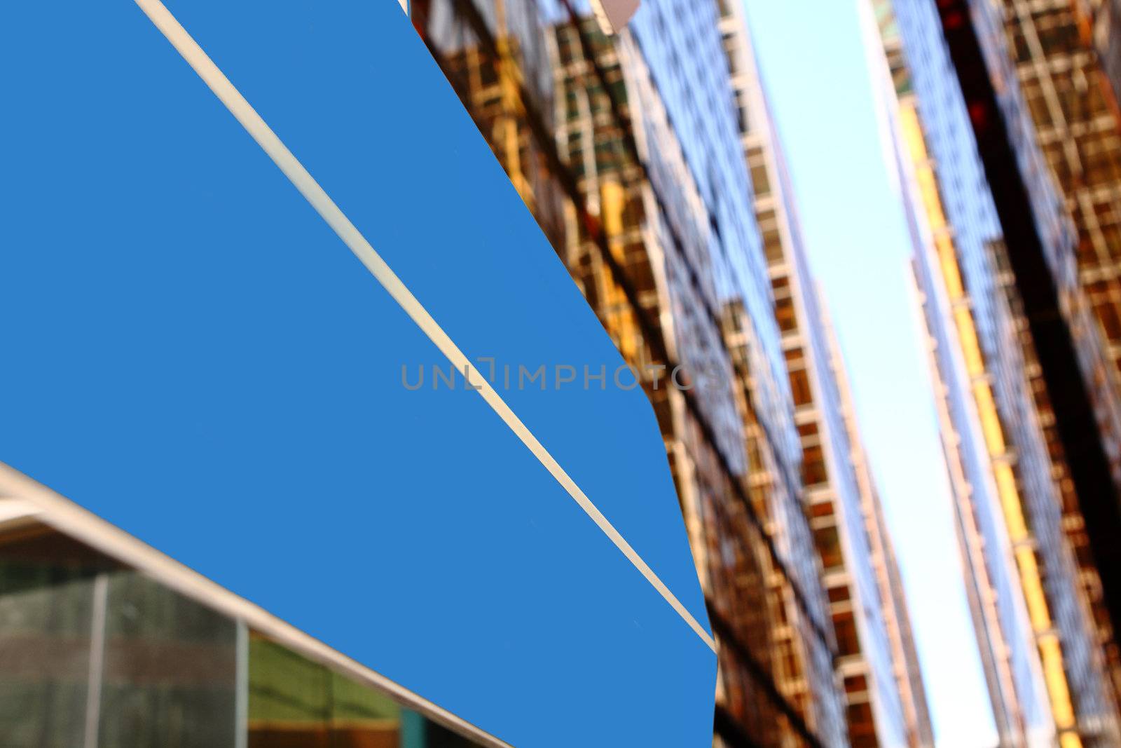Concept image of a signpost against a modern glass office building 