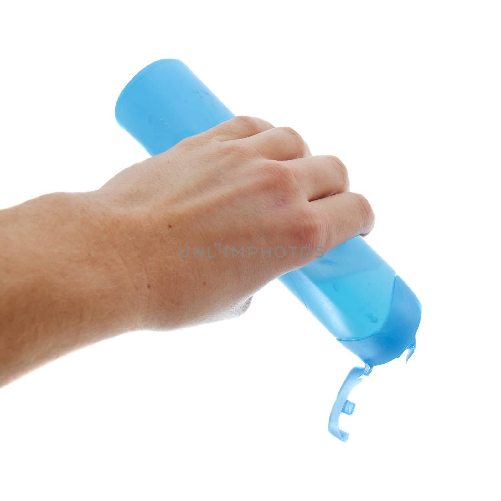 Pouring shower gel from a plastic bottle