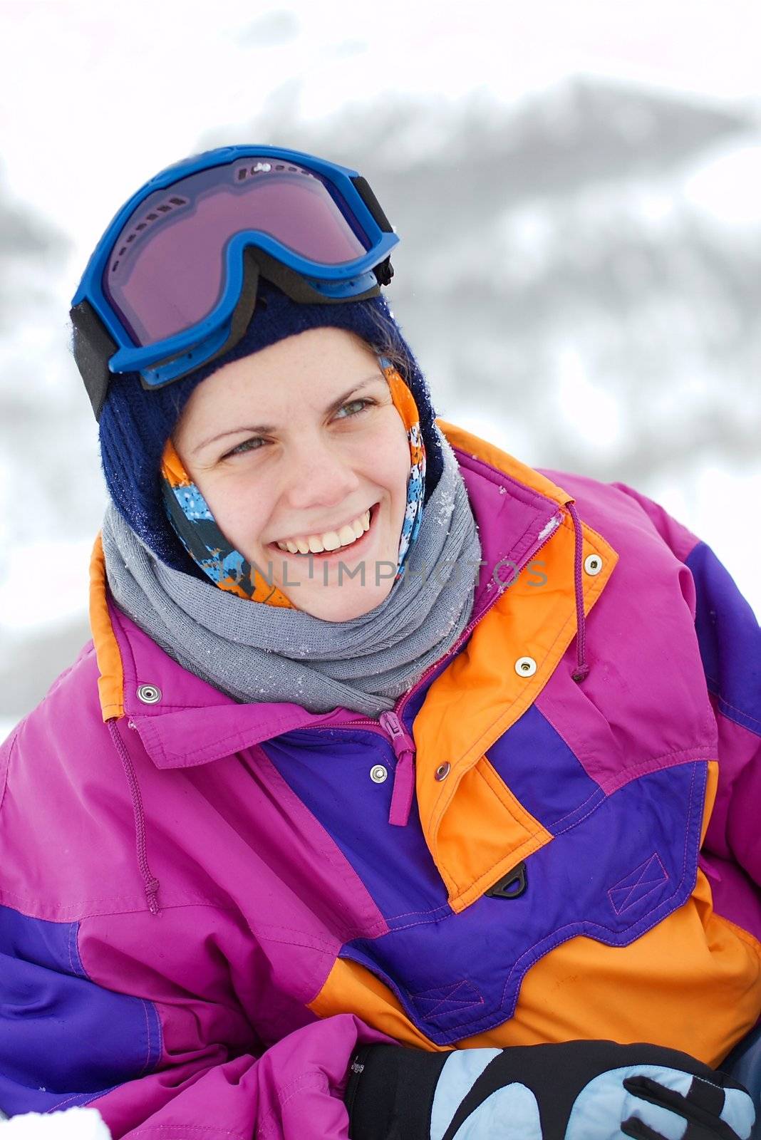 young female skier laughing happily