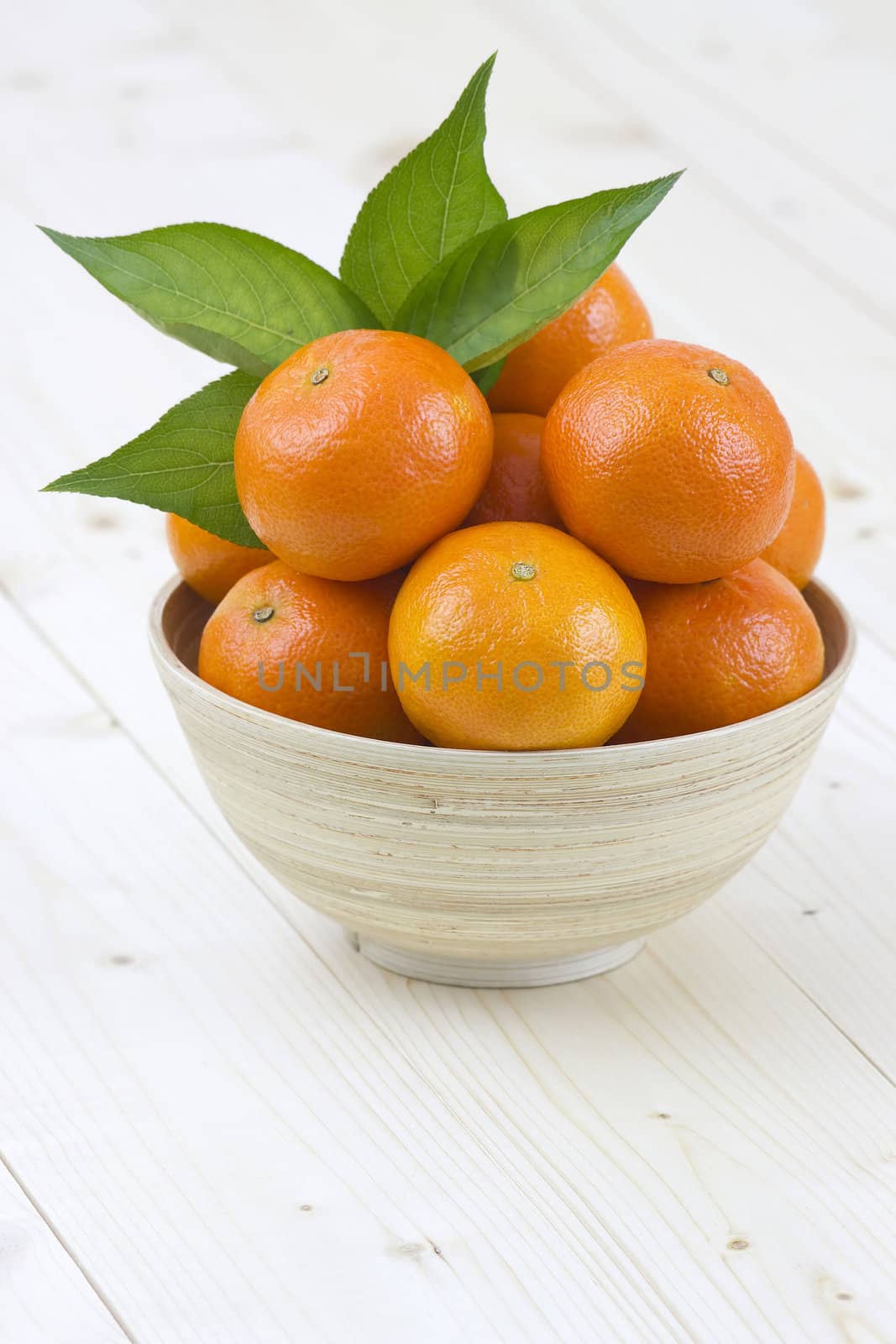 bowl of fresh tangerines by miradrozdowski