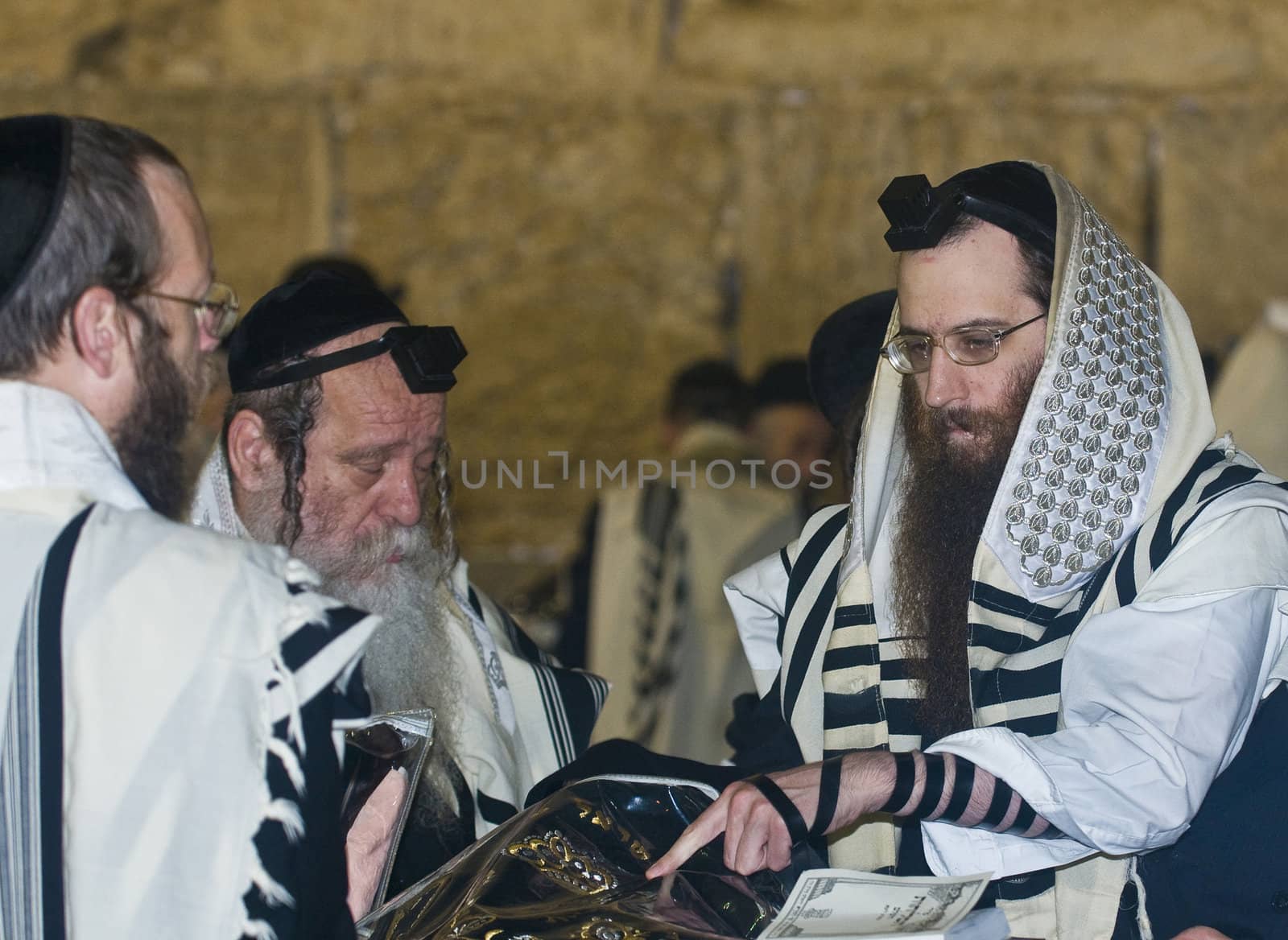 JERUSALEM - SEP 26 : Jewish men prays during the penitential prayers the "Selichot" , held on September 26 2011 in the "Wailing wall"  in  Jerusalem , Israel 