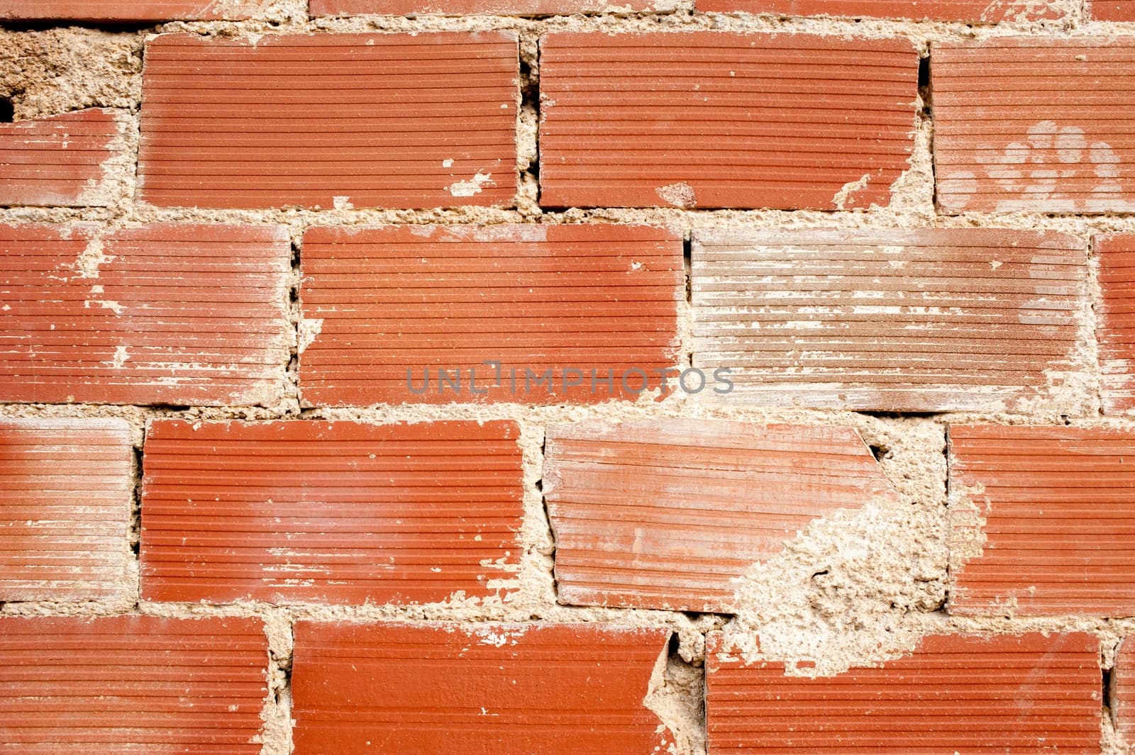 Full frame take of a  old, rough and weathered brick wall