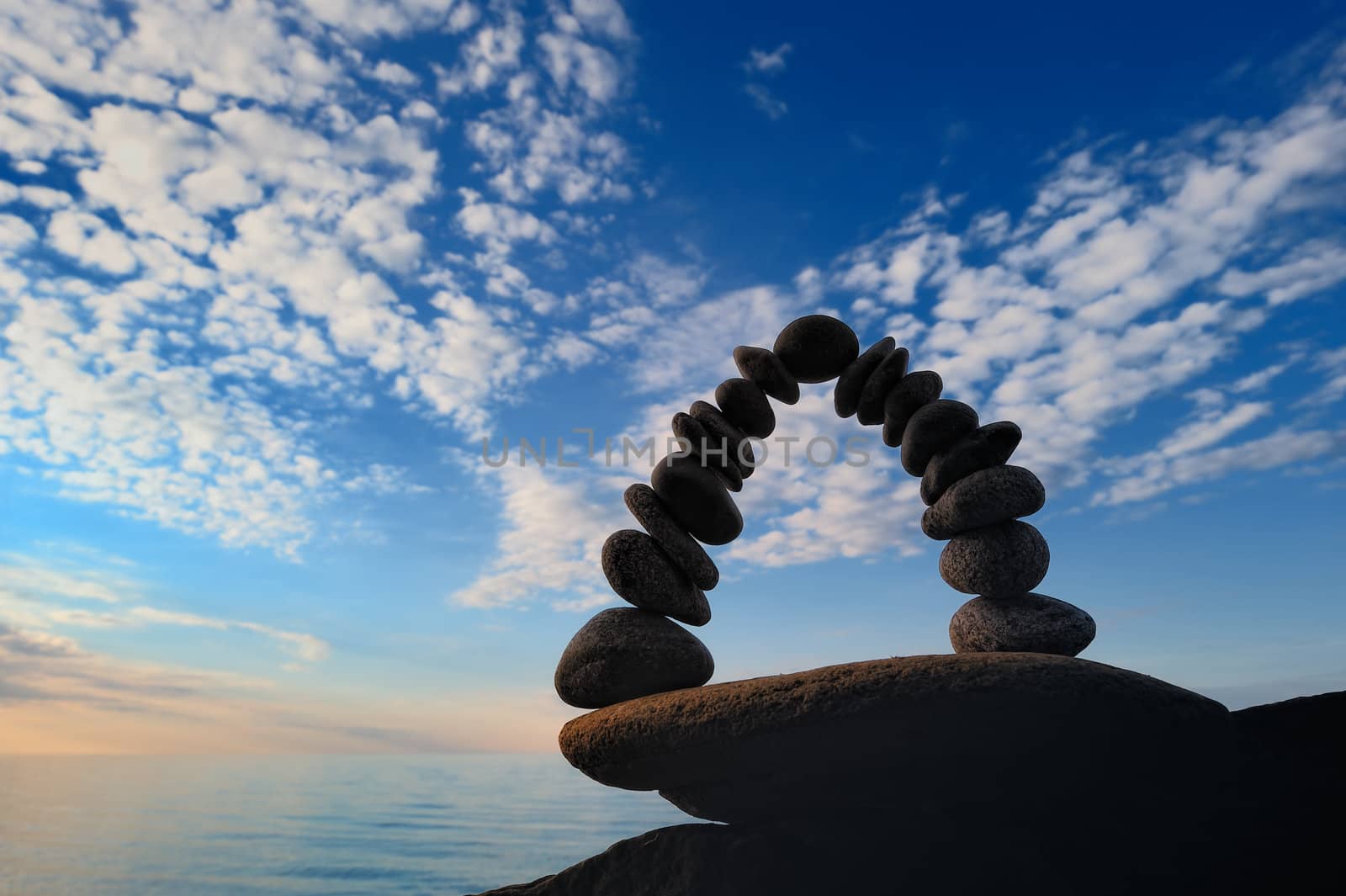 Crookedness of the pebbles on the seashore in evening