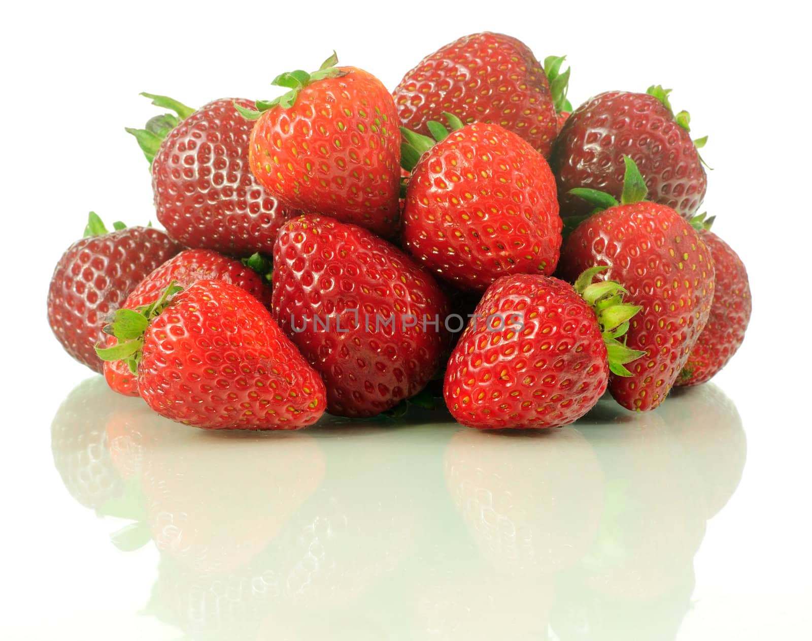 Fresh bunch of vivid strawberries isolated over white with reflection 