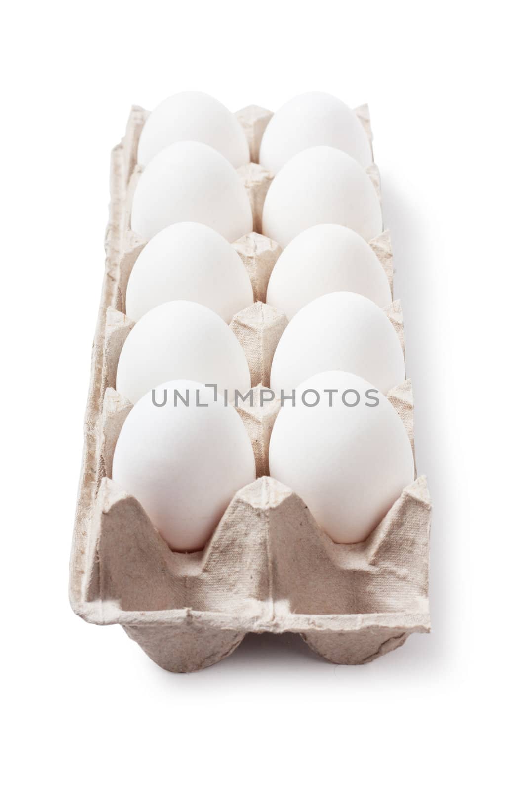 White eggs in carton. Nutritious eating.
