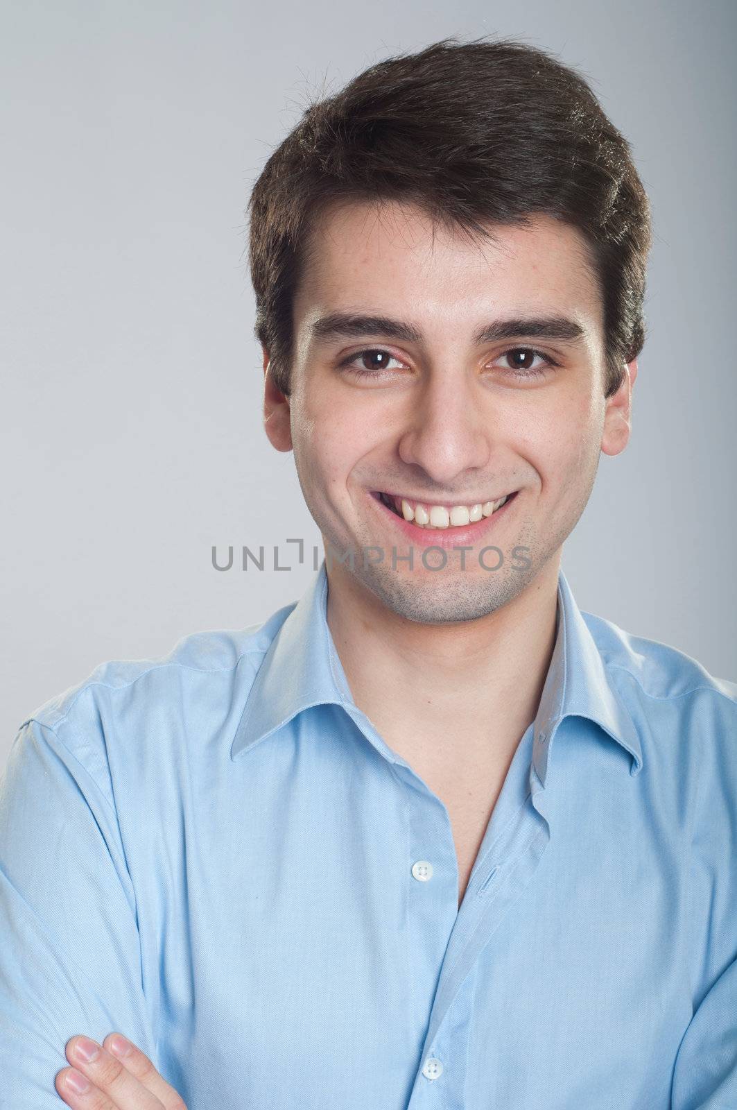 portrait of a smiling handsome trainee starting business career