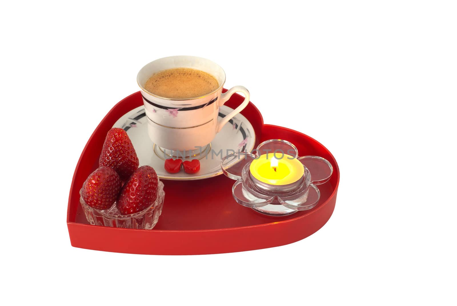Romantic breakfast with strawberries on red heart shaped tray