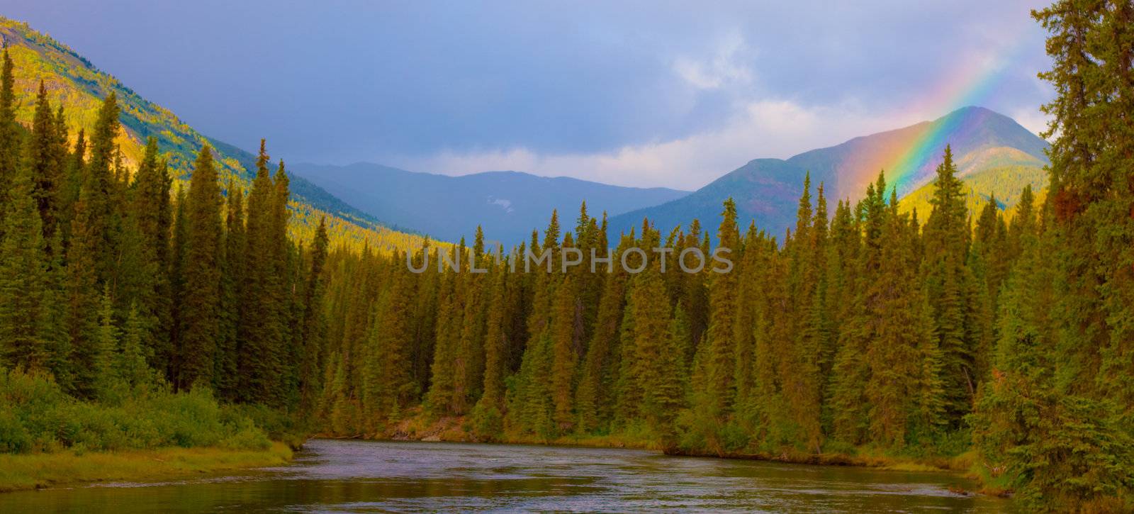 Rainbow in beautiful valley of Big Salmon River, Yukon Territory, Canada