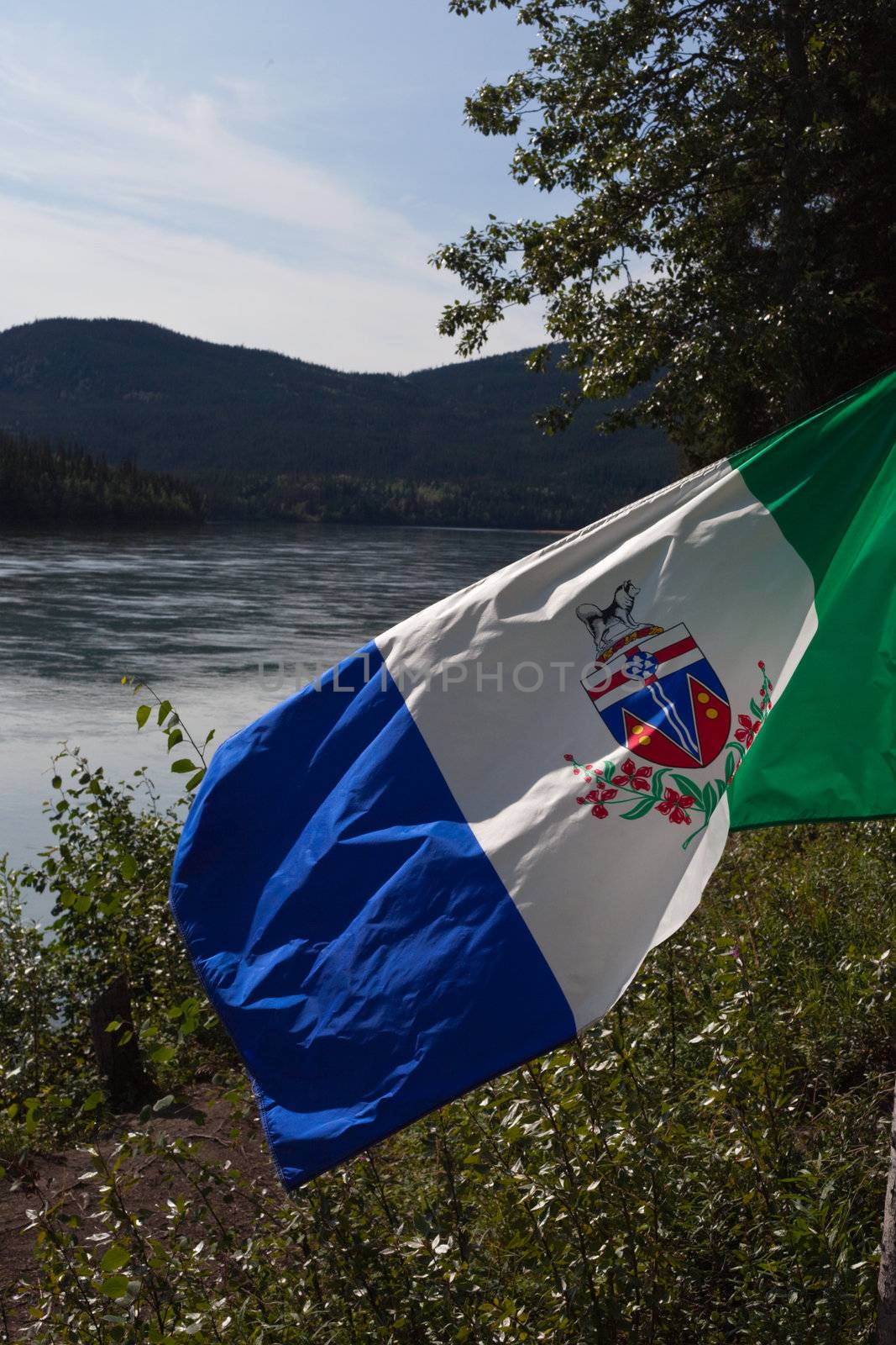 Yukon flag in front of Yukon River by PiLens