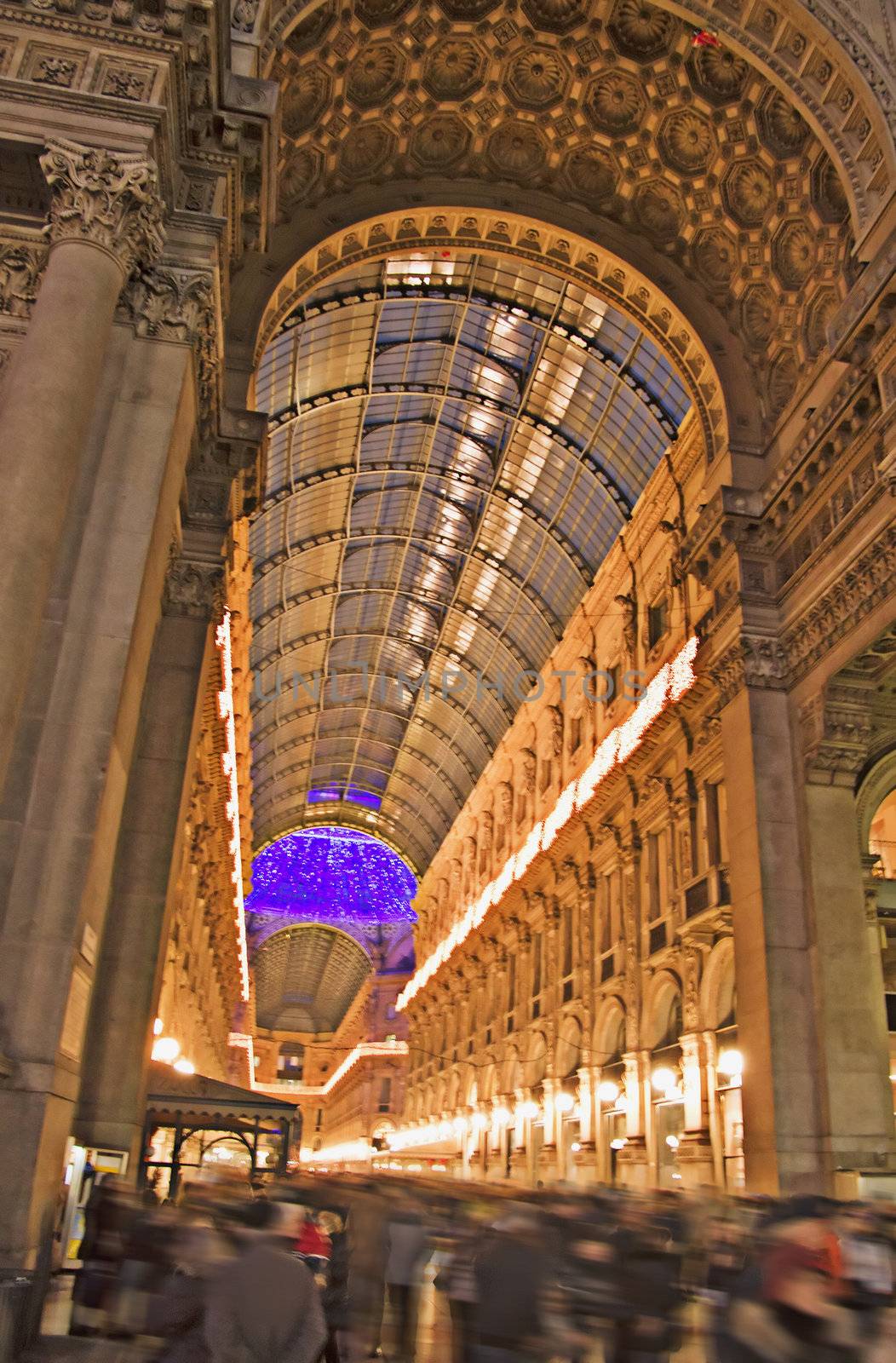 View of the "Galleria Vittorio Emanuele", characteristic gallery in piazza Duomo at Milano, Italy, with pedestrians voluntarily blurred away