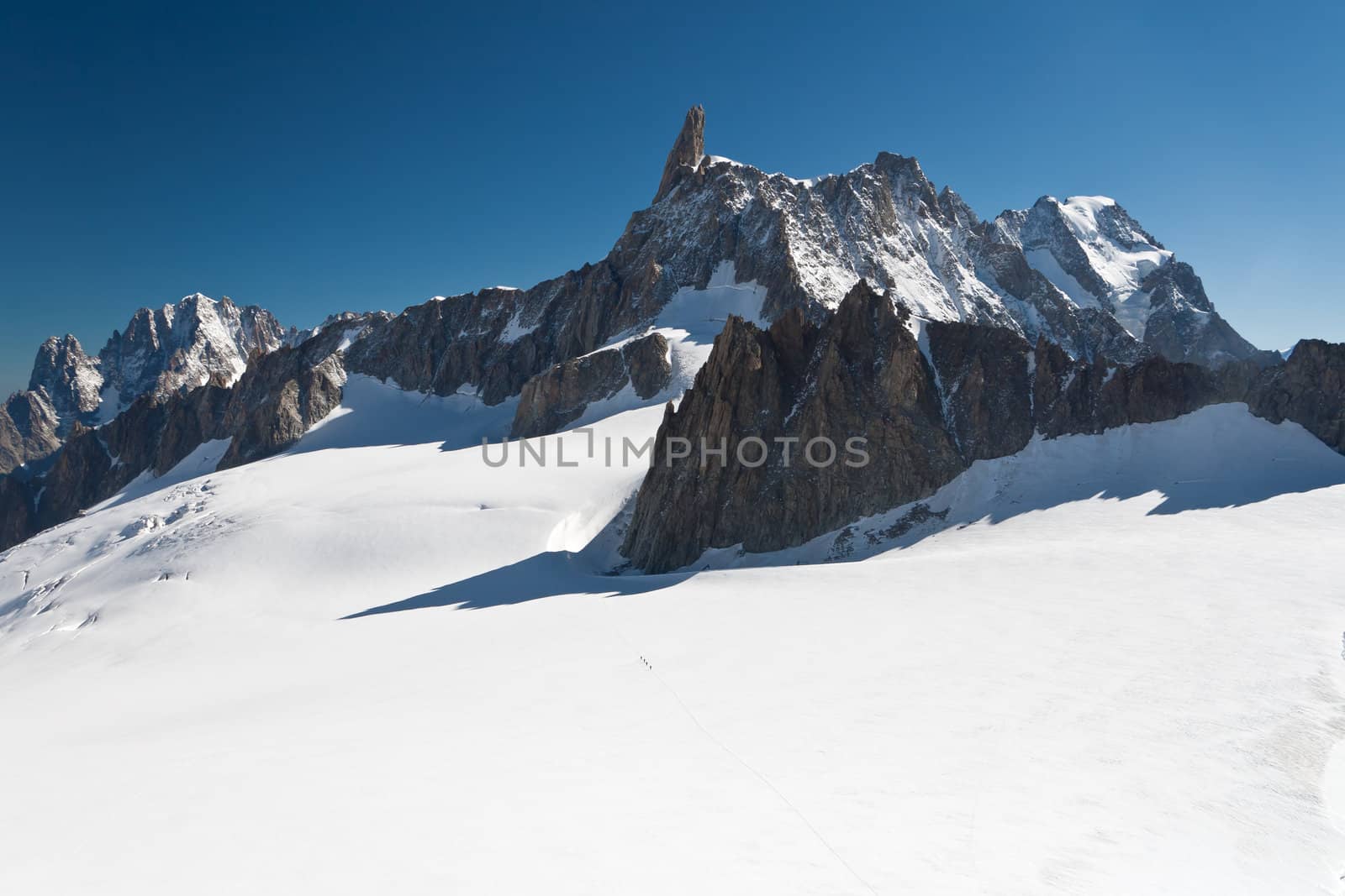 summer view of Dent du Geant peak and glacier in Mont Blanc massif