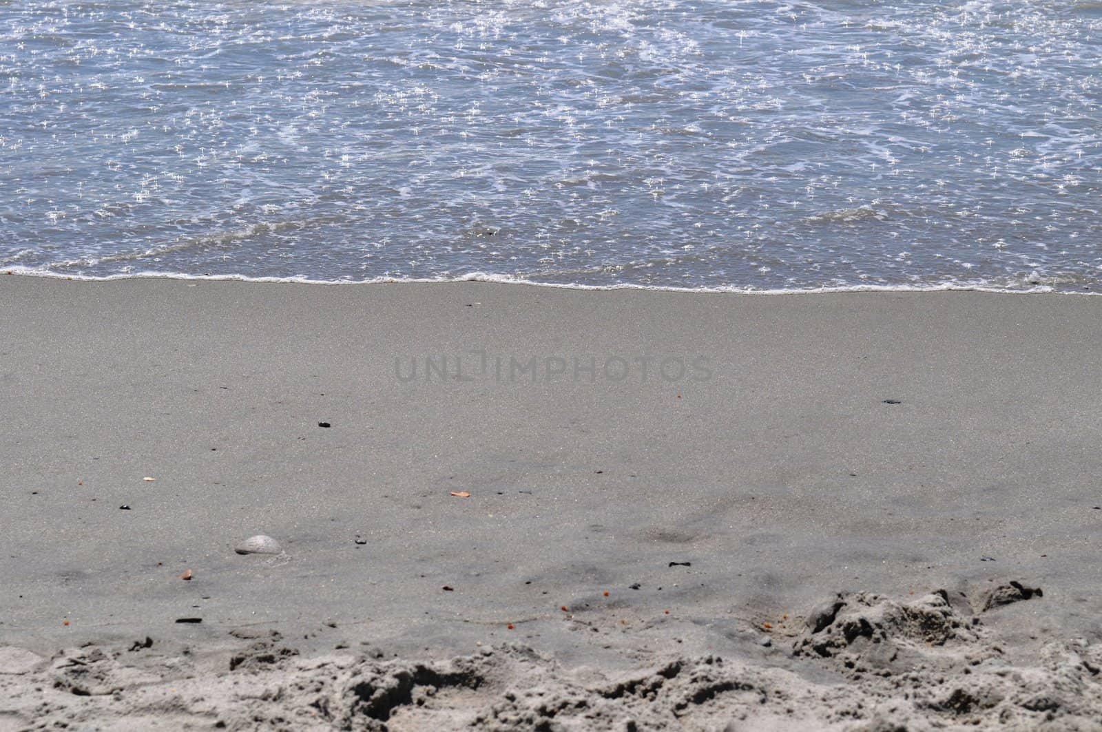 Sand and Waves by RefocusPhoto