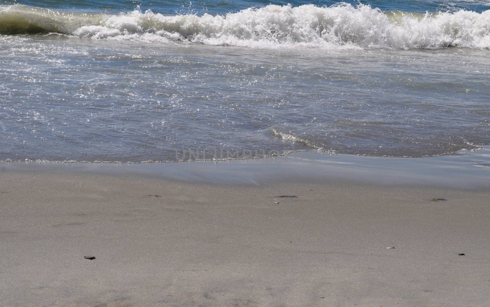 Sand and Waves by RefocusPhoto