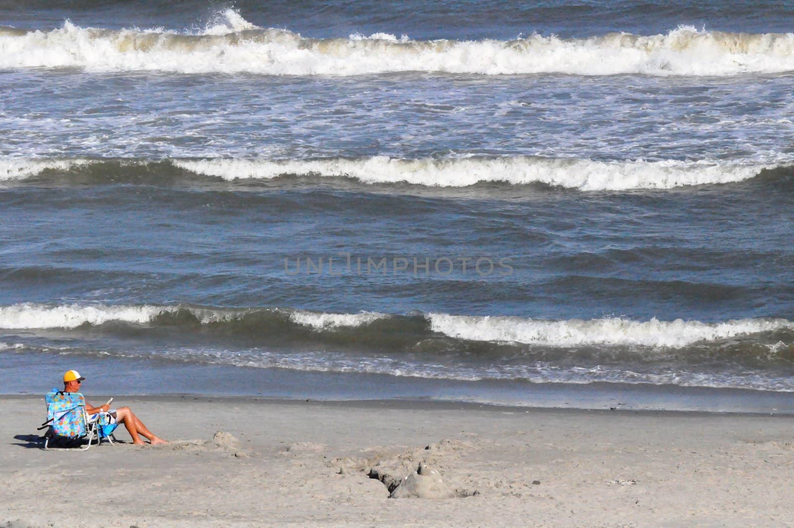 Reading on the beach by RefocusPhoto