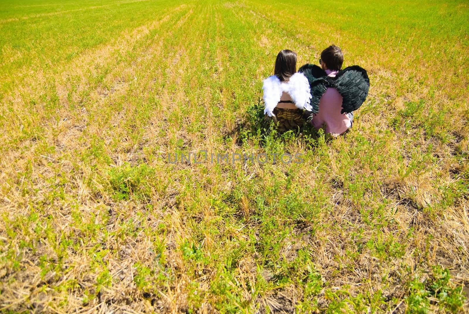 Young happy couple on the field. Shoot on the nature.