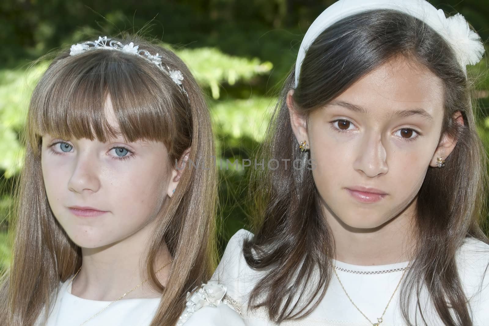 girls white dress the day of their first communion
