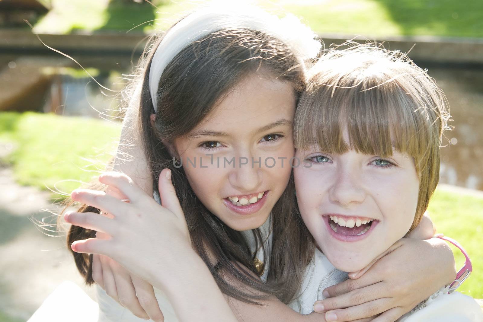girls white dress the day of their first communion
