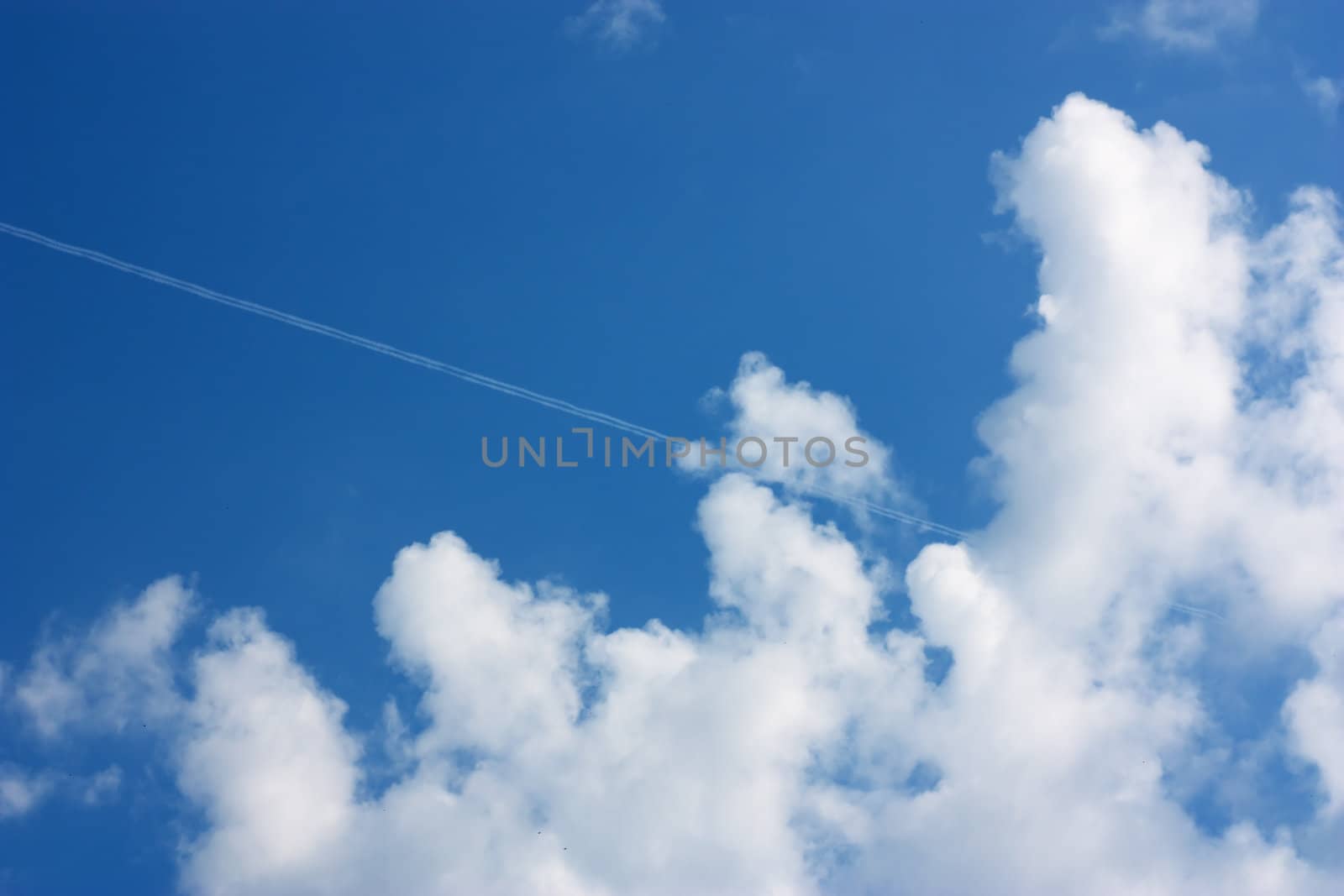 Sky background with clouds on track from a plane