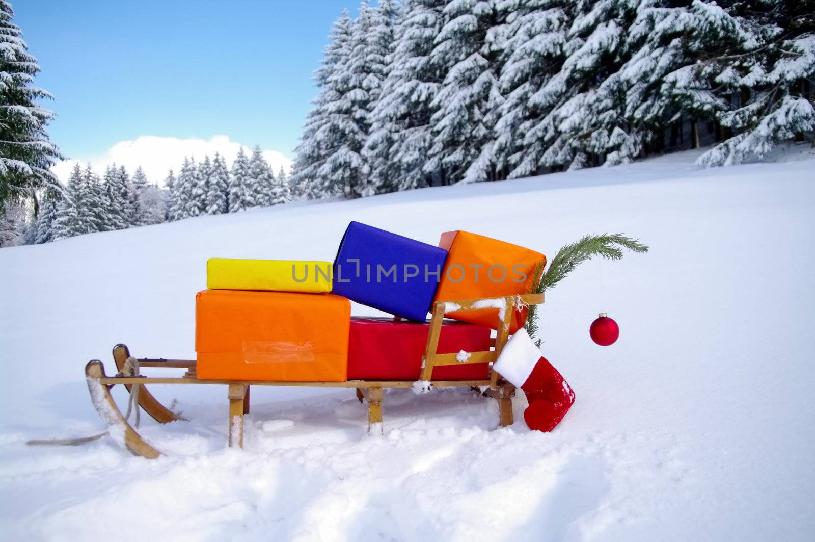 colorful presents on a Santa Claus sledge in a winter landscape