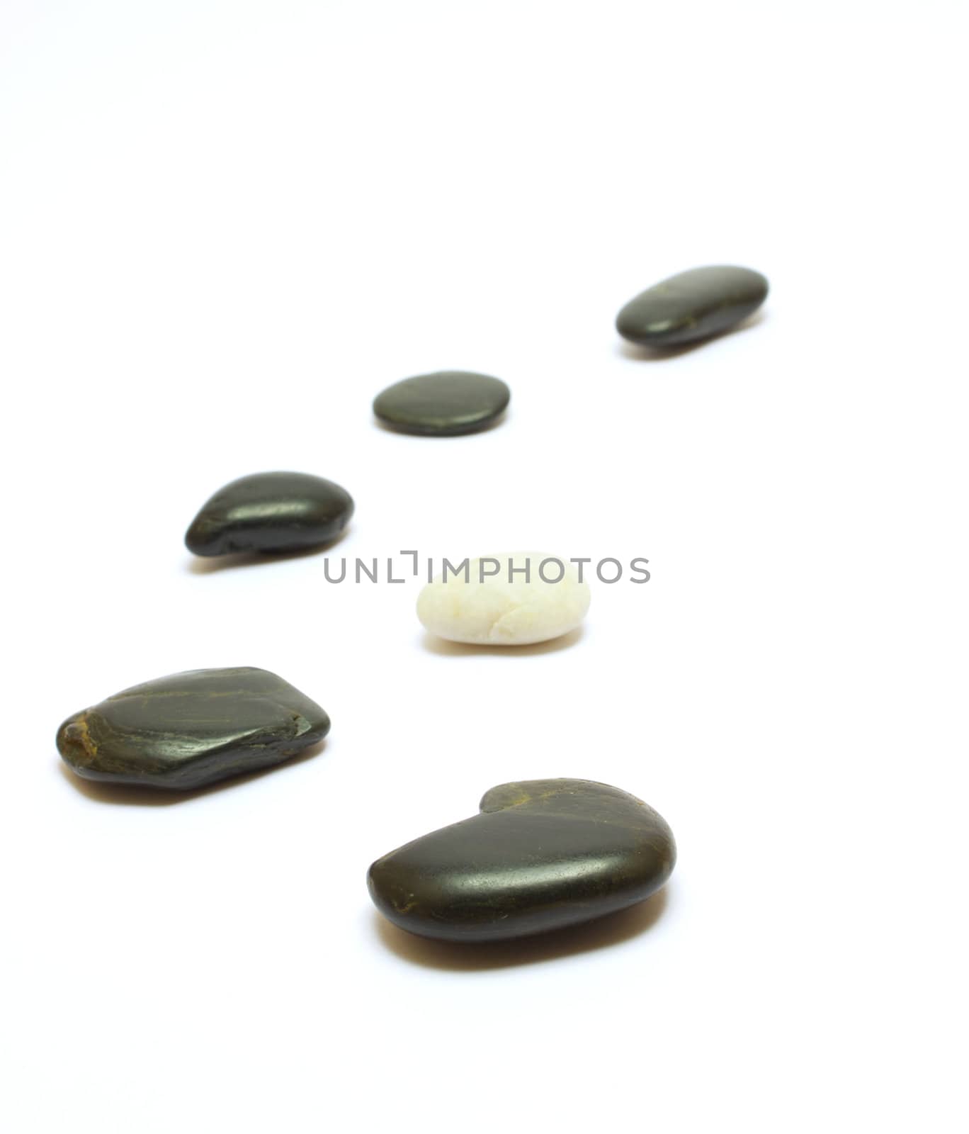 Black and white stones isolated on white by ursolv