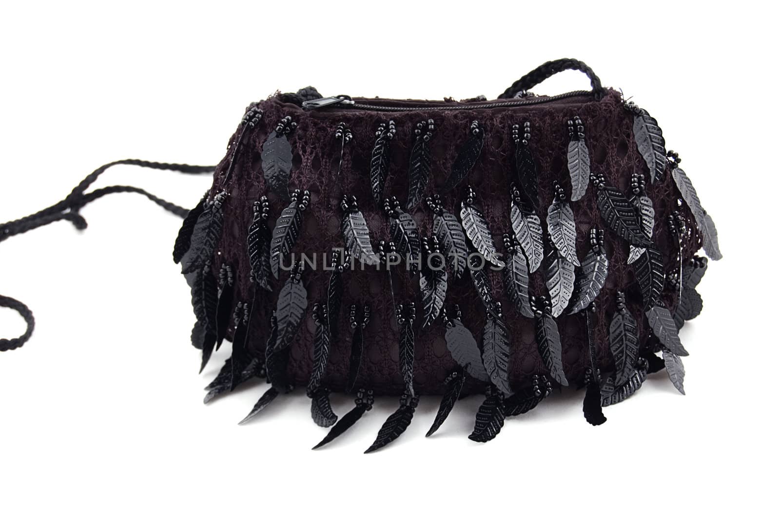 Female black evening clutch embroidered over white