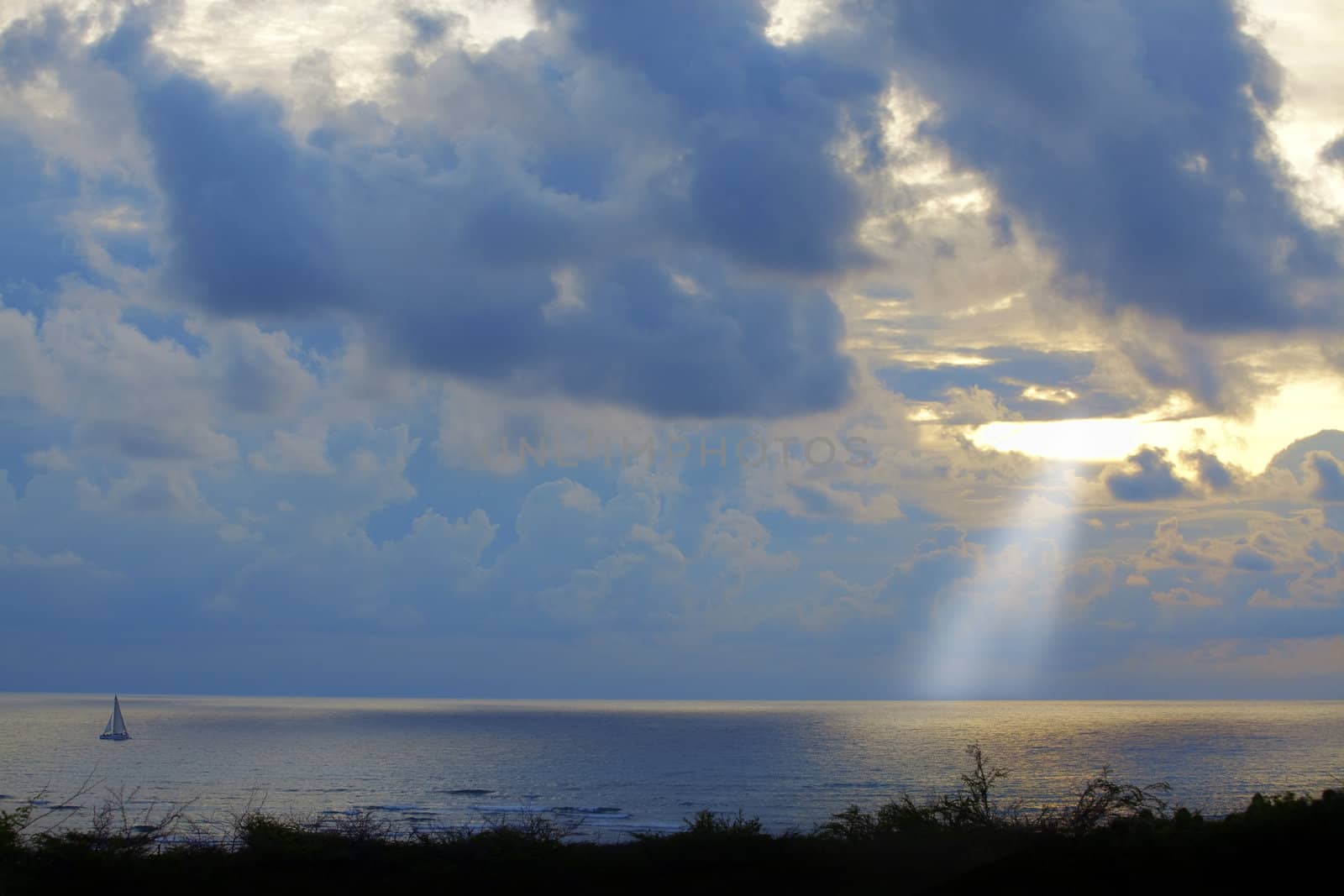 Sailboat in the sunset at the Caribbean waters