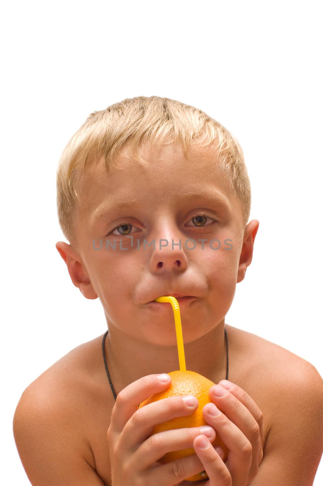 The boy drank the juice from an orange through a straw is isolated on a white background.