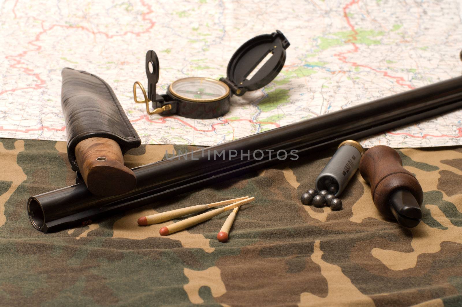 Subjects of the hunting ammunition on a camouflage fabric.