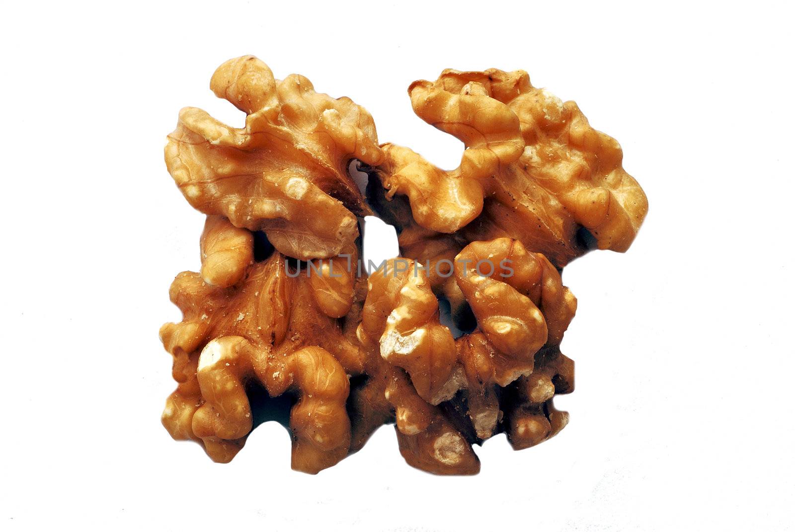 shelled walnuts over white background