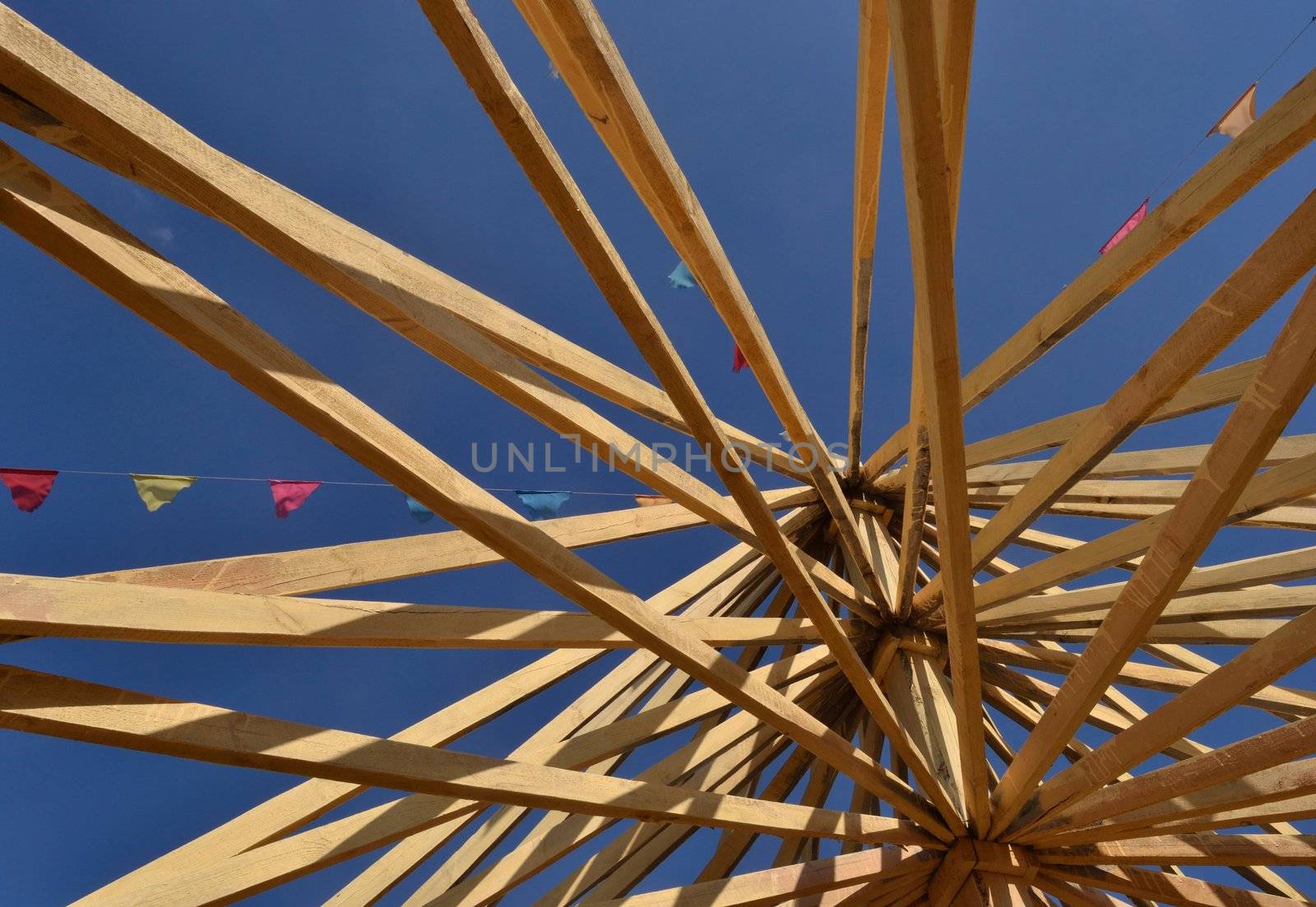 View of the wooden roof structure over clear  blue sky