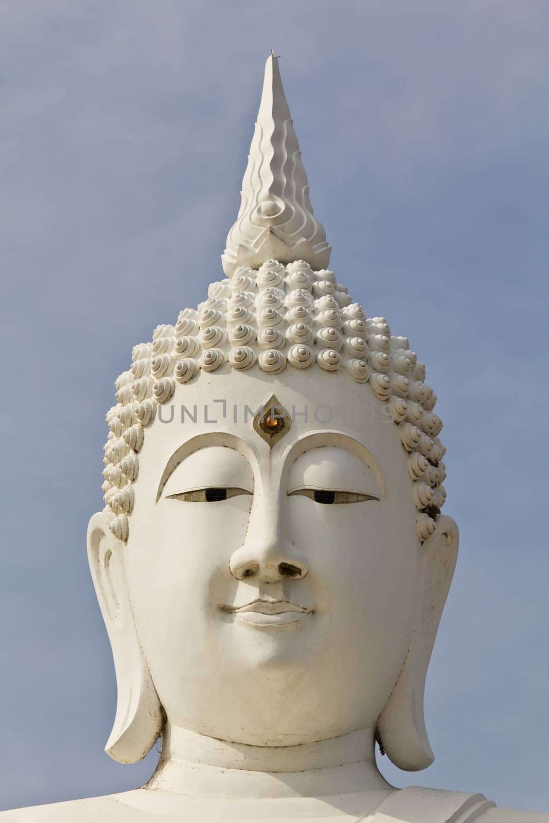 white face buddha image in temple Thailand