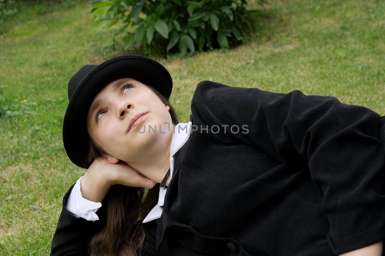 Girl in suit relaxing in the park