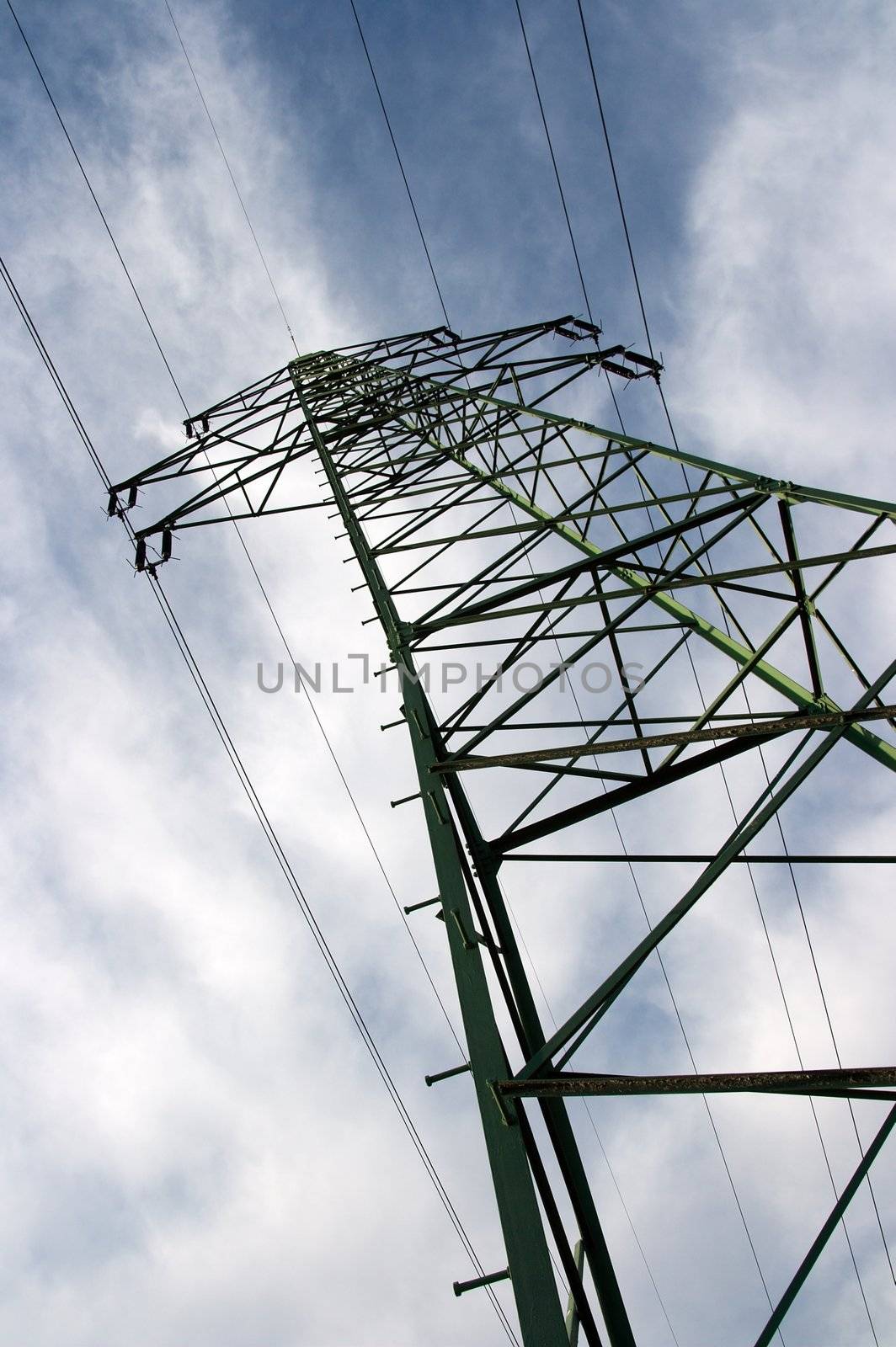 High voltage electric pillar against blue sky