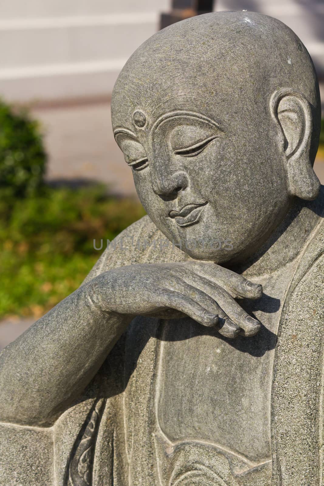 Close up shot of the smile buddha face in temple Thailand