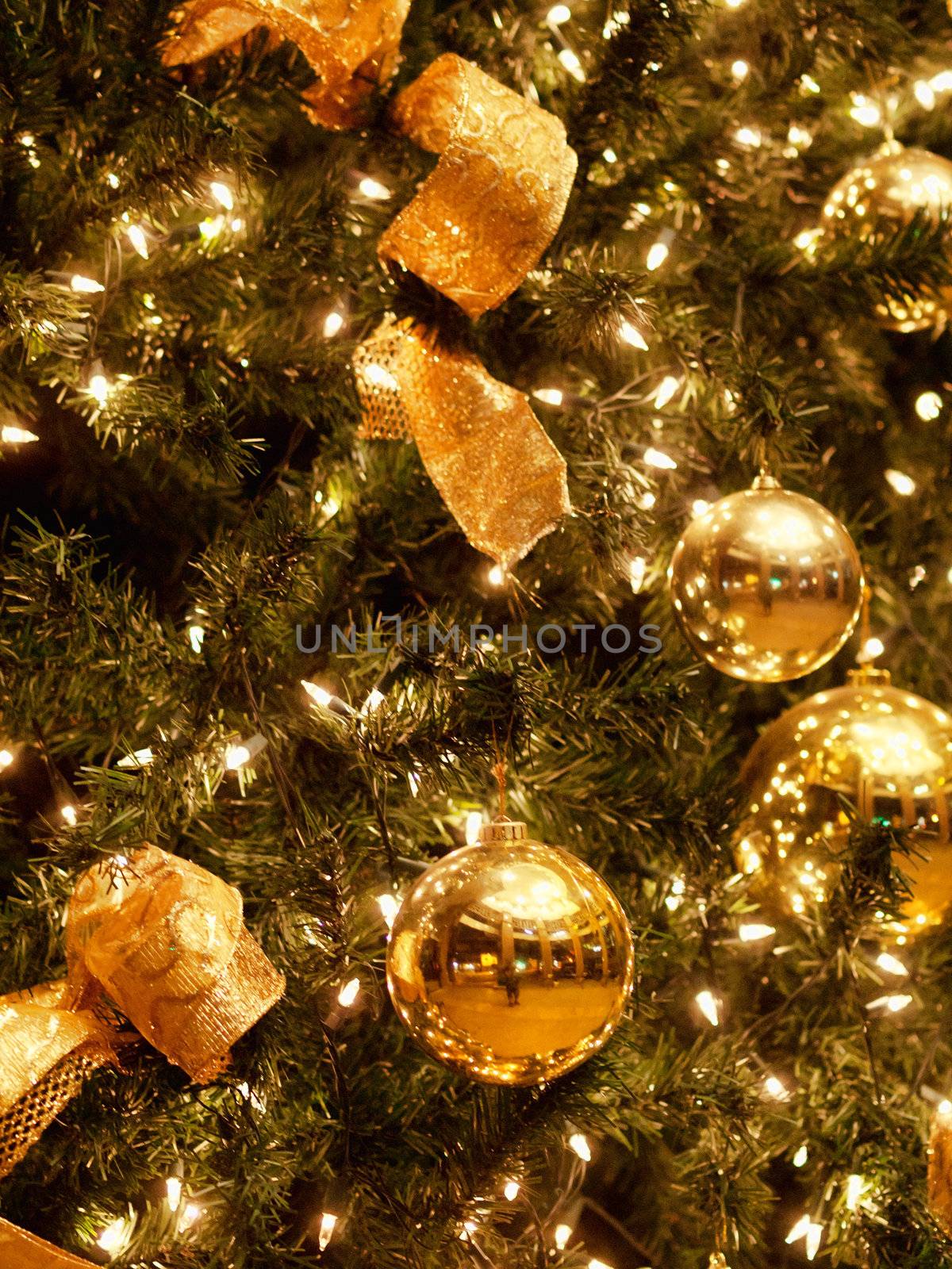 Background made of Christmas tree decorated with golden balls