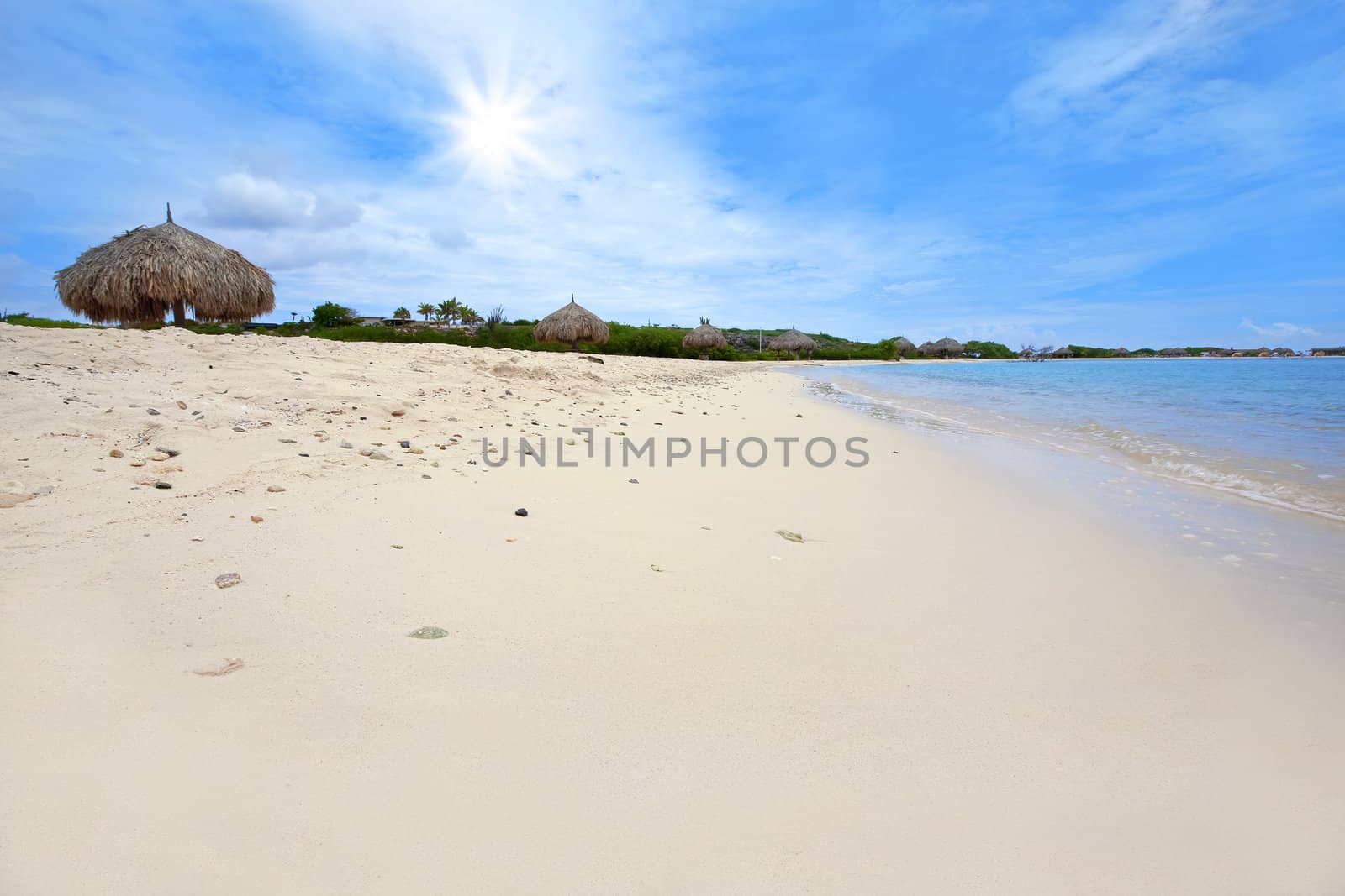 Turquoise water and beach huts on Baby beach, Aruba