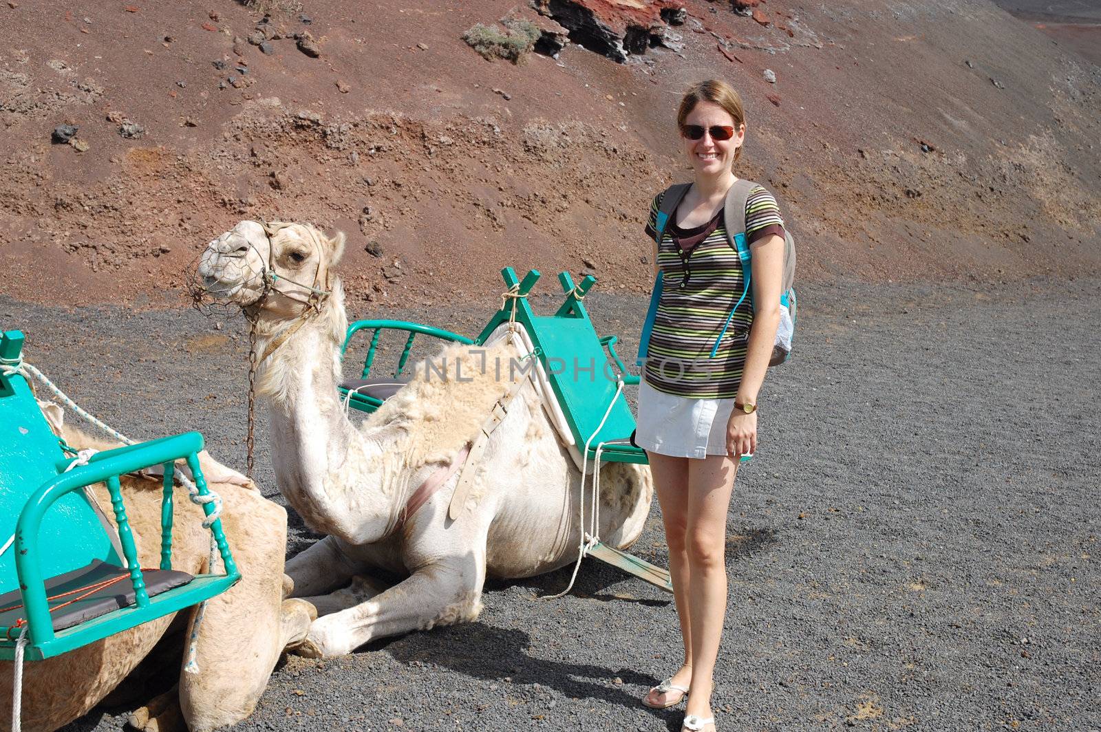 Young woman camel in timanfaya national park in lanzarote