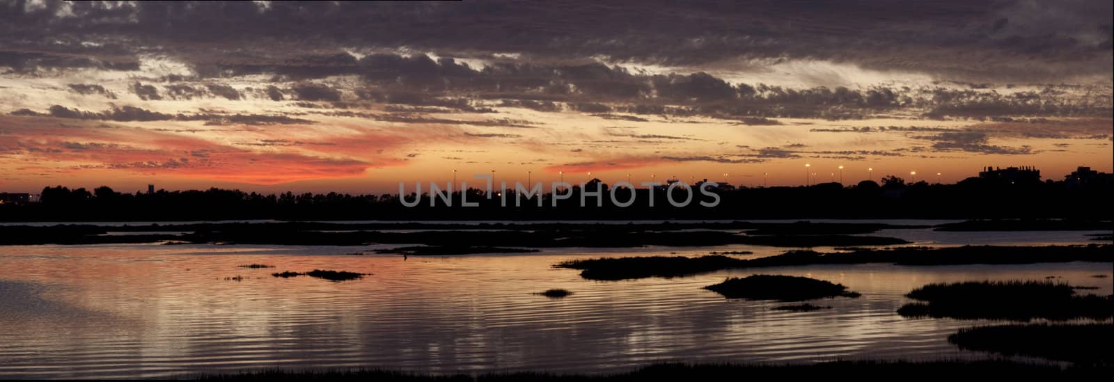 View of a beautiful sunset on the Ria Formosa region on the Algarve, Portugal.