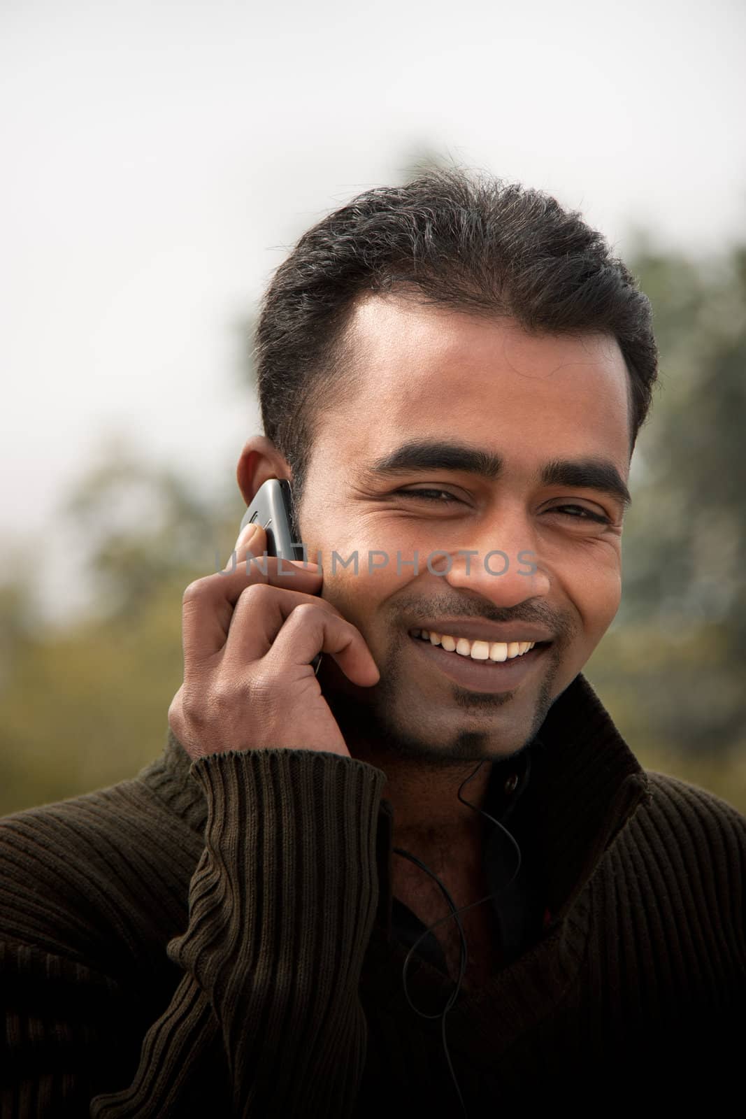 Indian man Busy on cell phone by ziprashantzi