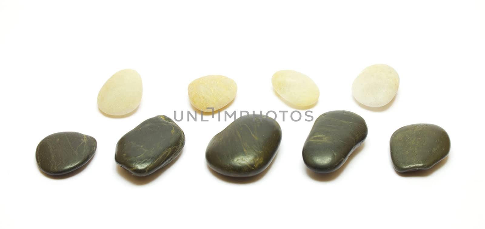 Black and white stones row isolated on white background