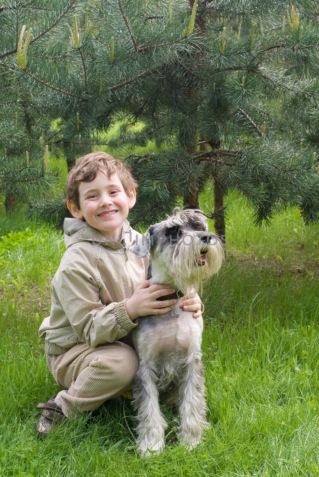 Little boy with his dog in the park by BIG_TAU