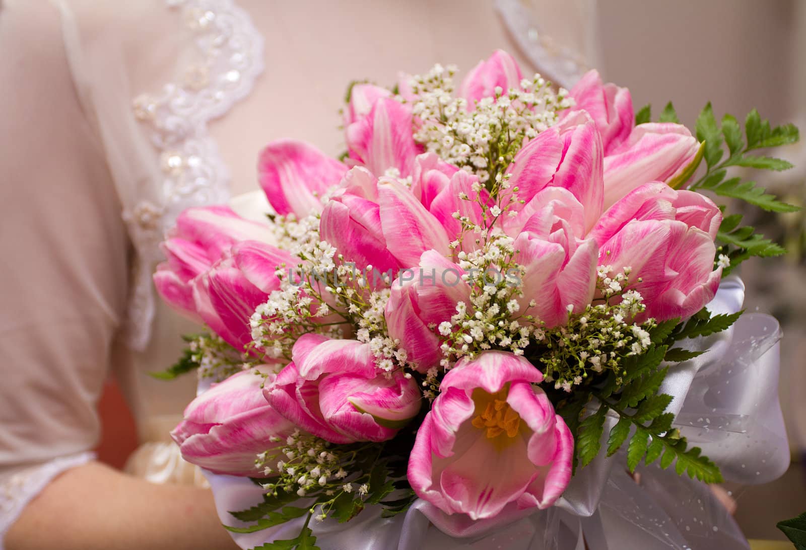 wedding bouquet in hands of bride