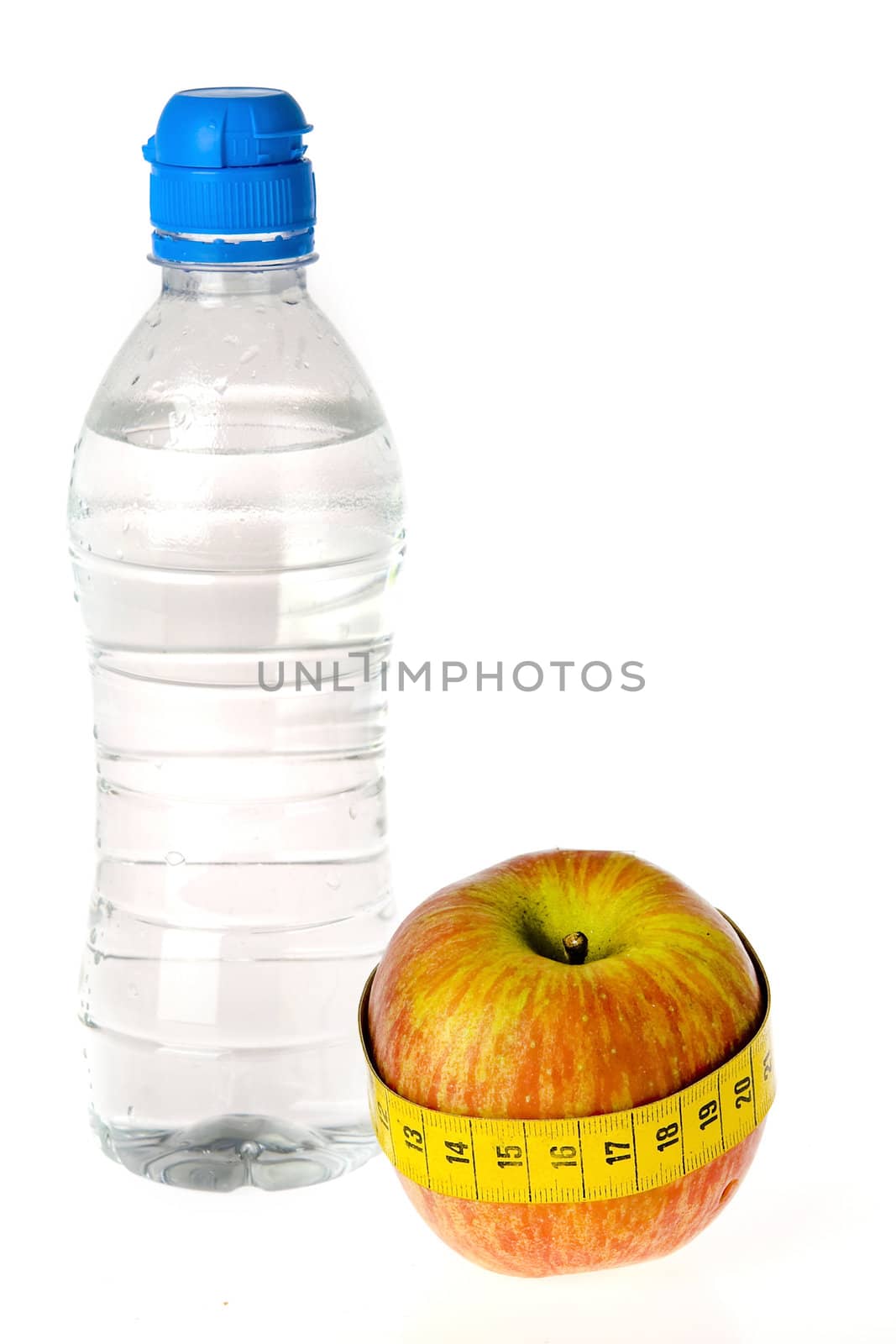 a bottle of water and an apple on a white background
