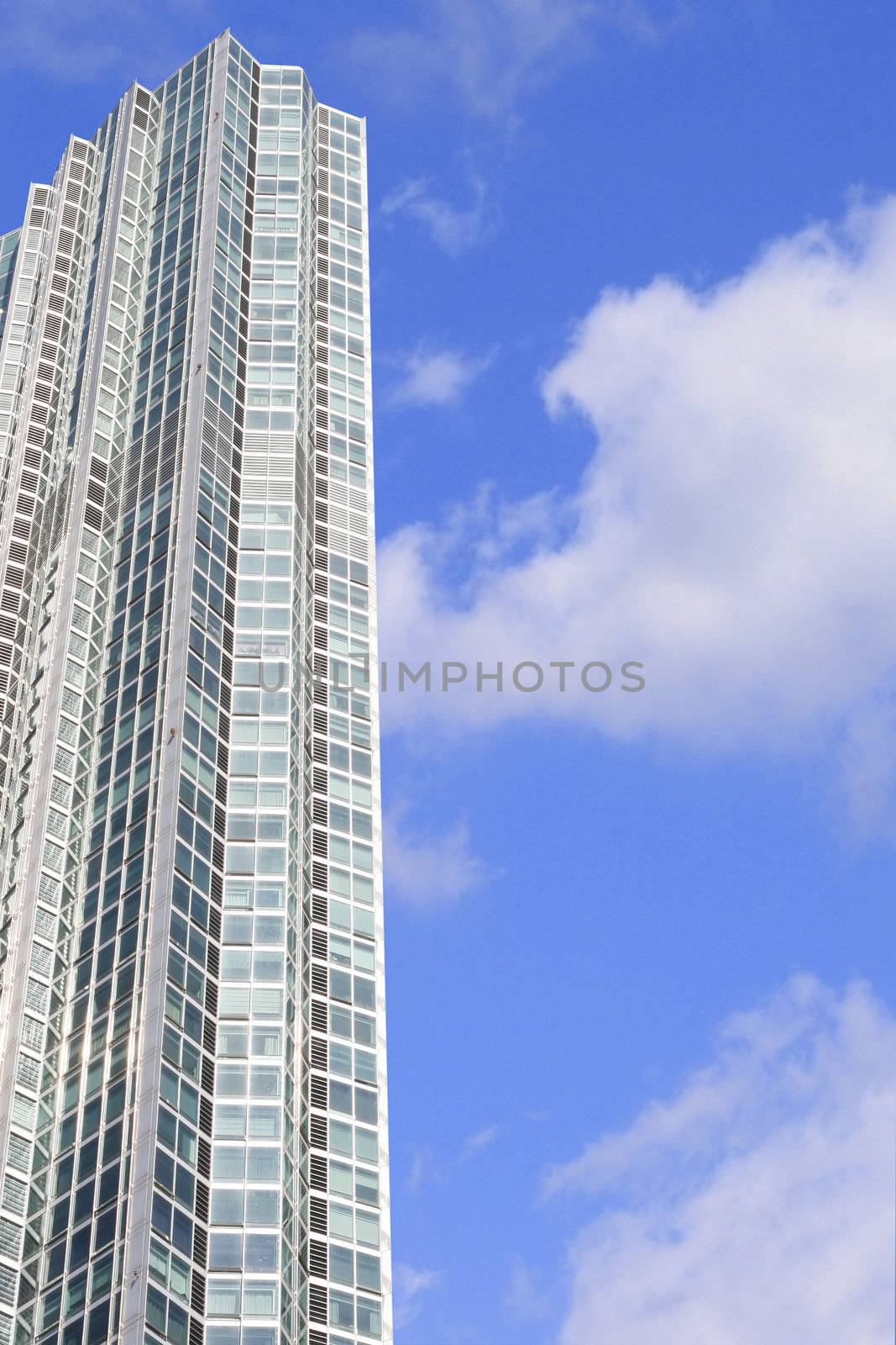 High rise building in Seoul Korea- a condominium with a beautiful sky blue background.