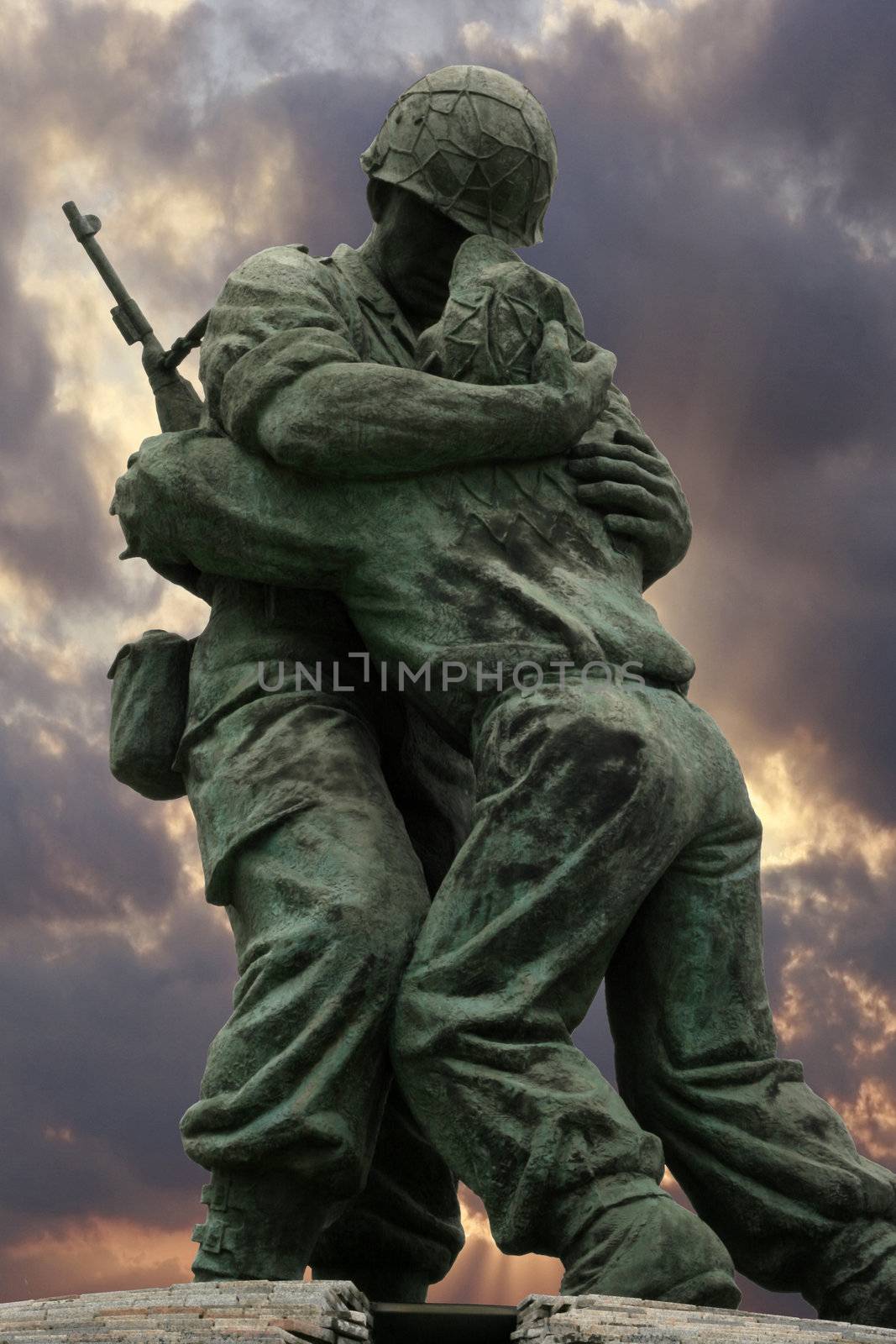 An unknown soldier statue in the Korean Memorial in Seoul Korea, with fierce dramatic sun blast at dusk- dramatic clouds with sunrays accentuating the horizon.