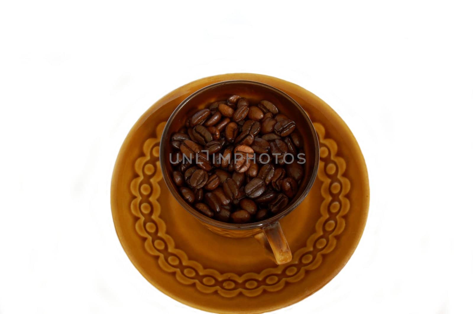 brown cup with coffee beans isolated on the white background