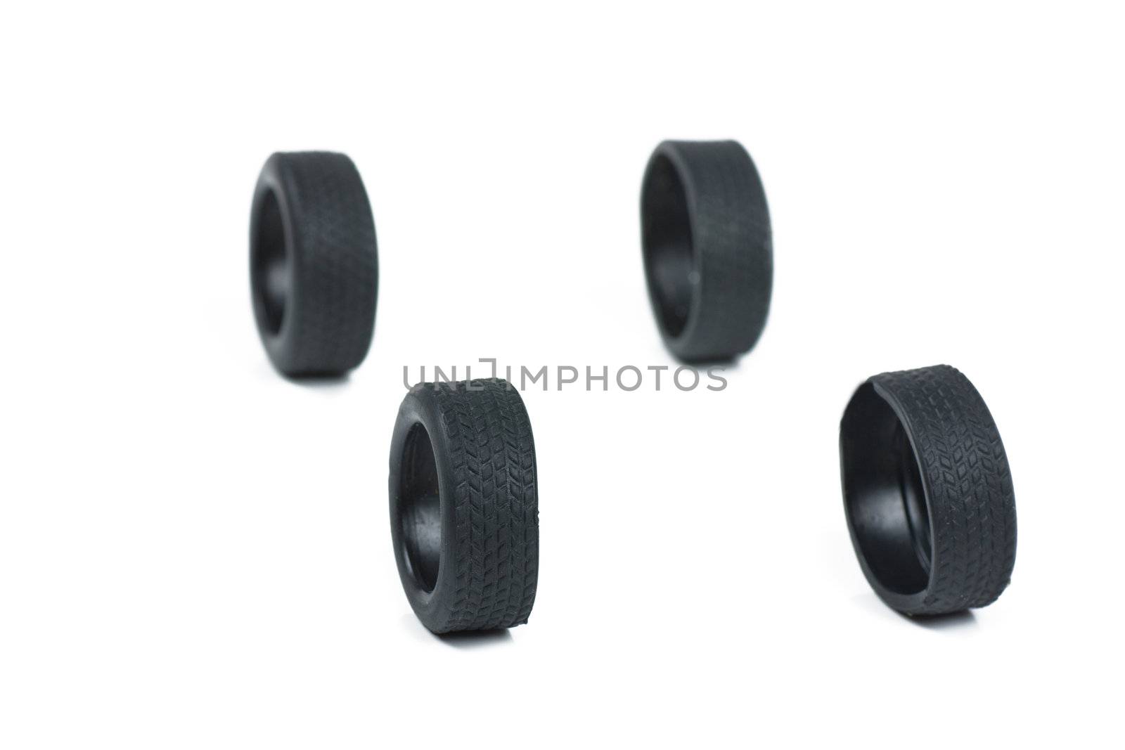 Four toy tires isolated on the white
