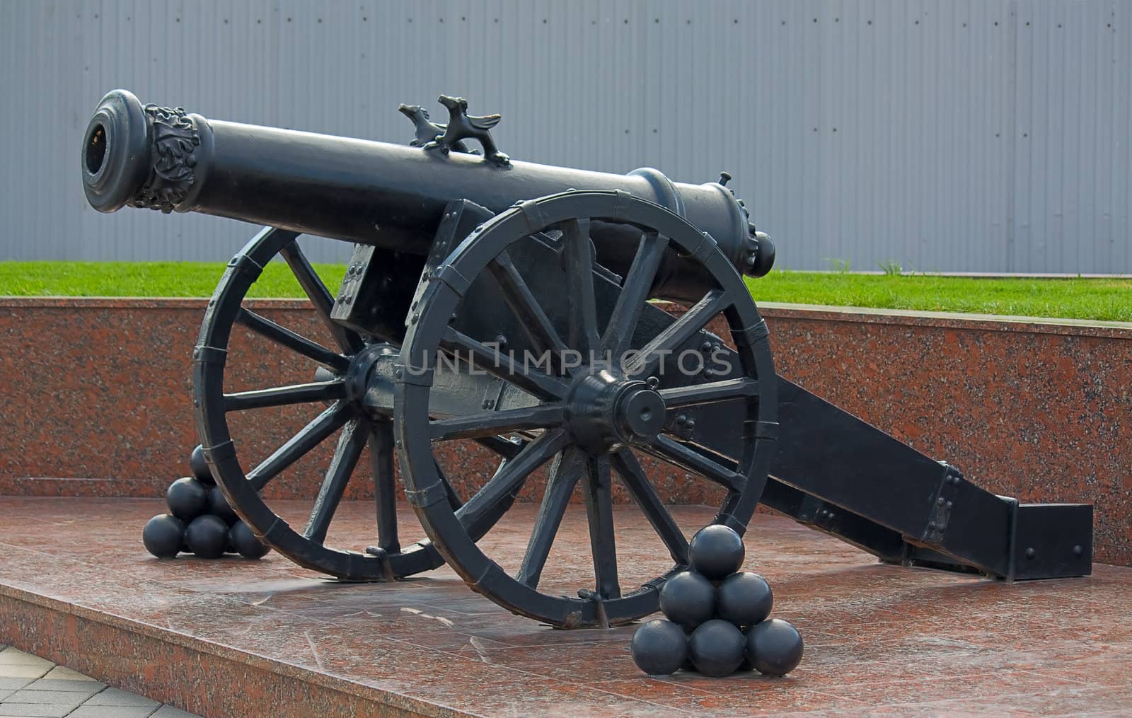 Old metal cannon with kernels on  pedestal, Novorossiysk, Russia.