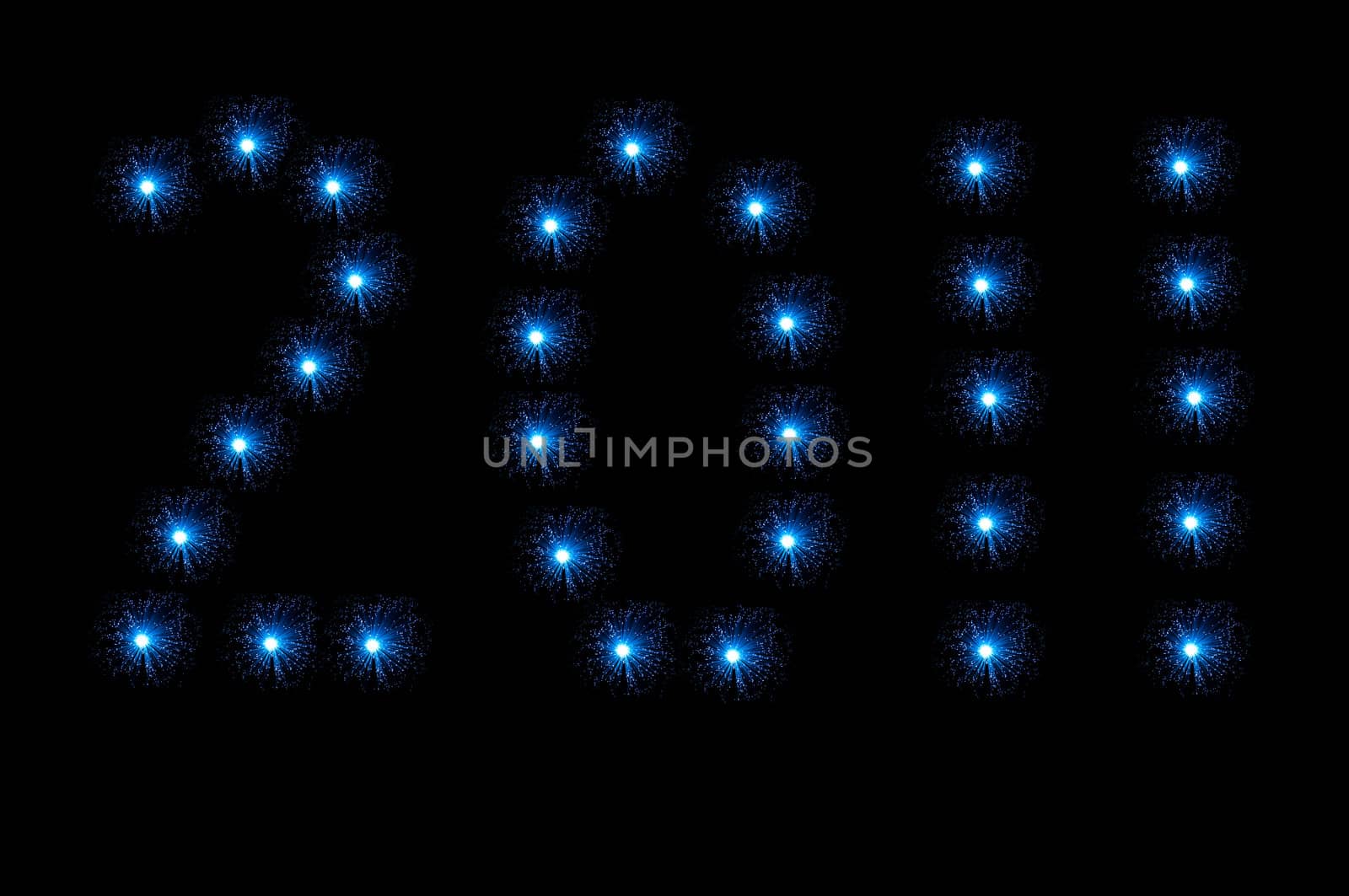 Many small blue illuminated fibre optic lamps arranged over white to spell the number 2011